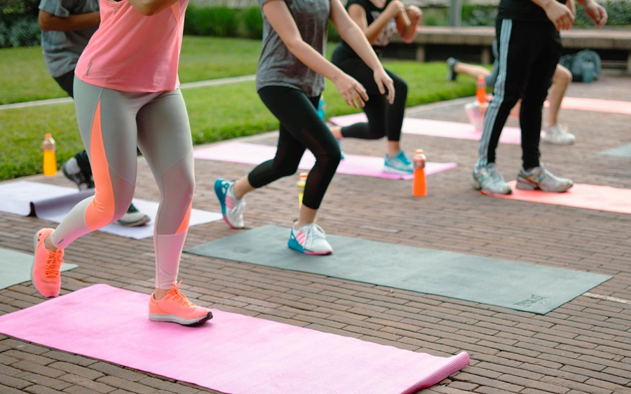 Group of people strengthening legs in a pilates class