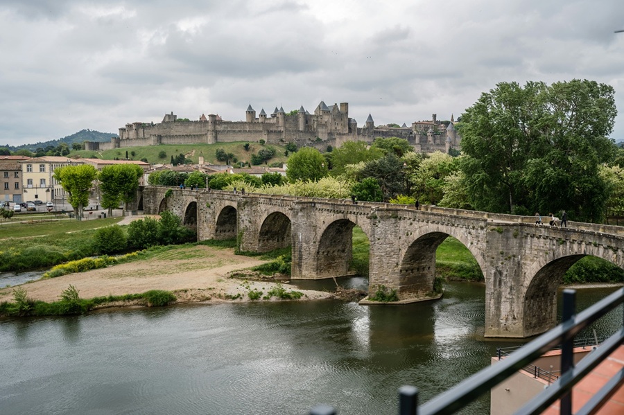 View of Carcassonne in the distance with a bridge in the foreground 