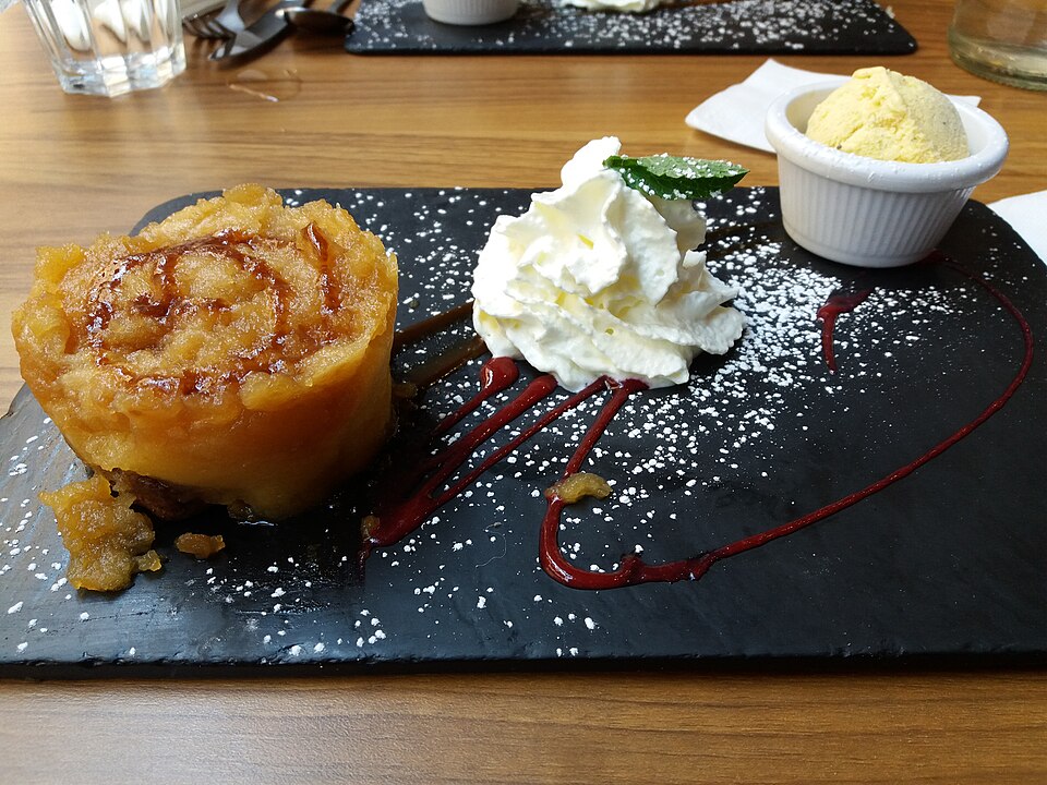 French apple tarte tatin served with chantilly cream and ice cream